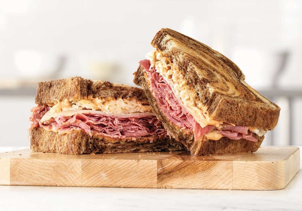 Arby's roast beef sandwich with curly fries and drink